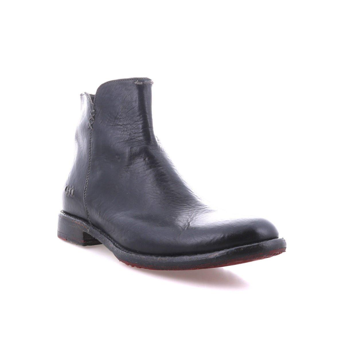The Yurisa by Bed|Stü is a single black handcrafted ankle boot with a low heel, visible stitching, and a durable leather outsole, displayed against a plain white background.