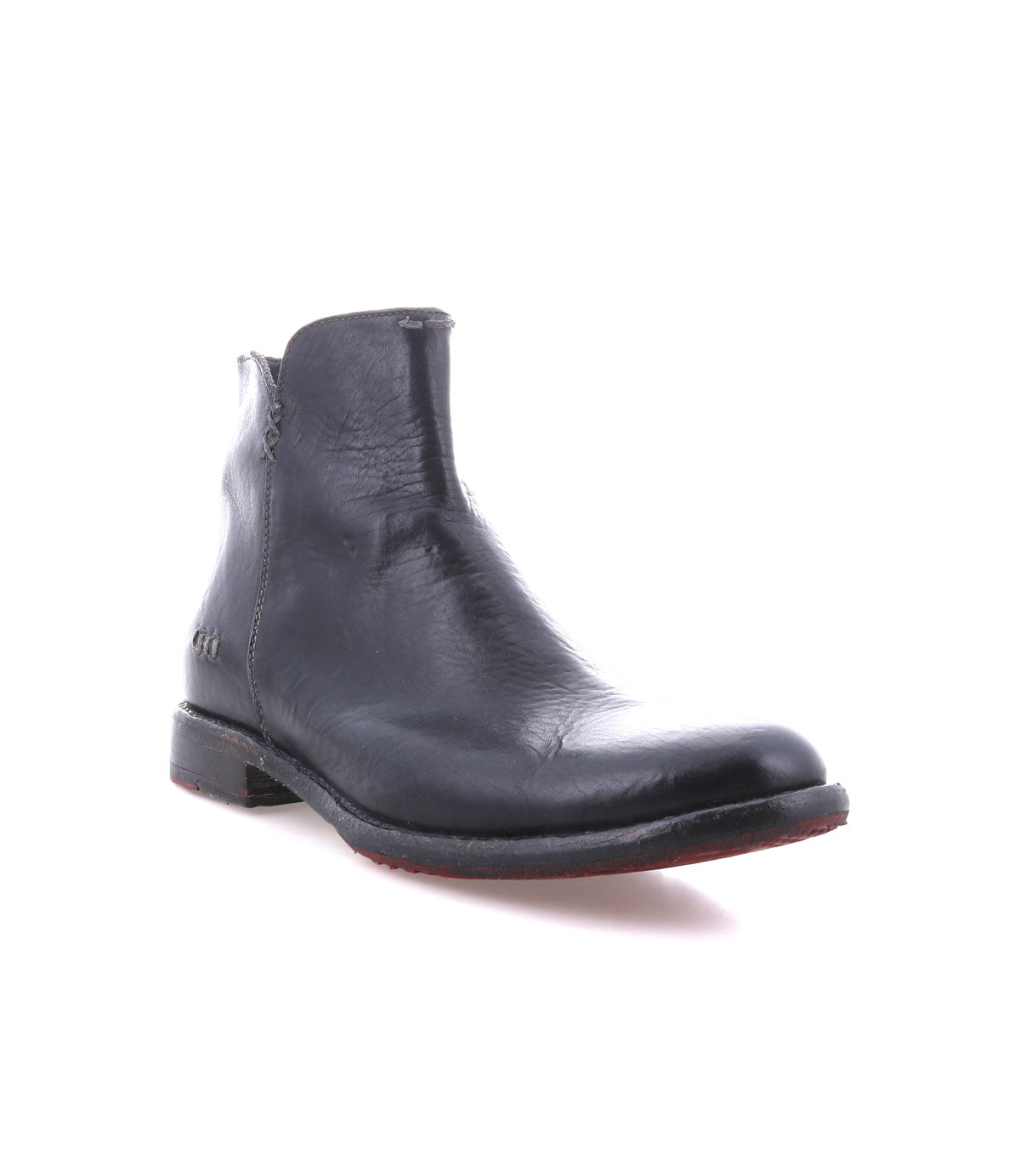 The Yurisa by Bed|Stü is a single black handcrafted ankle boot with a low heel, visible stitching, and a durable leather outsole, displayed against a plain white background.