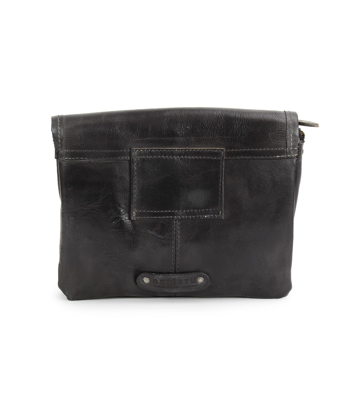 Introducing the Ziggy JB by Bed|Stü—a black leather pouch featuring a front patch detail, visible seams, and a top zipper closure. Perfect as a sleek clutch or an elegant crossbody bag.