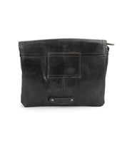 Introducing the Ziggy JB by Bed|Stü—a black leather pouch featuring a front patch detail, visible seams, and a top zipper closure. Perfect as a sleek clutch or an elegant crossbody bag.
