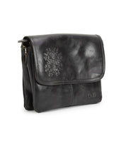 Introducing the Ziggy JB by Bed|Stü—a compact black leather shoulder bag featuring a flap closure, subtle embossed detailing on the front, and distinctive metal hardware on the side. Designed for versatility, this stylish accessory effortlessly transitions from a chic clutch to a fashionable crossbody bag.