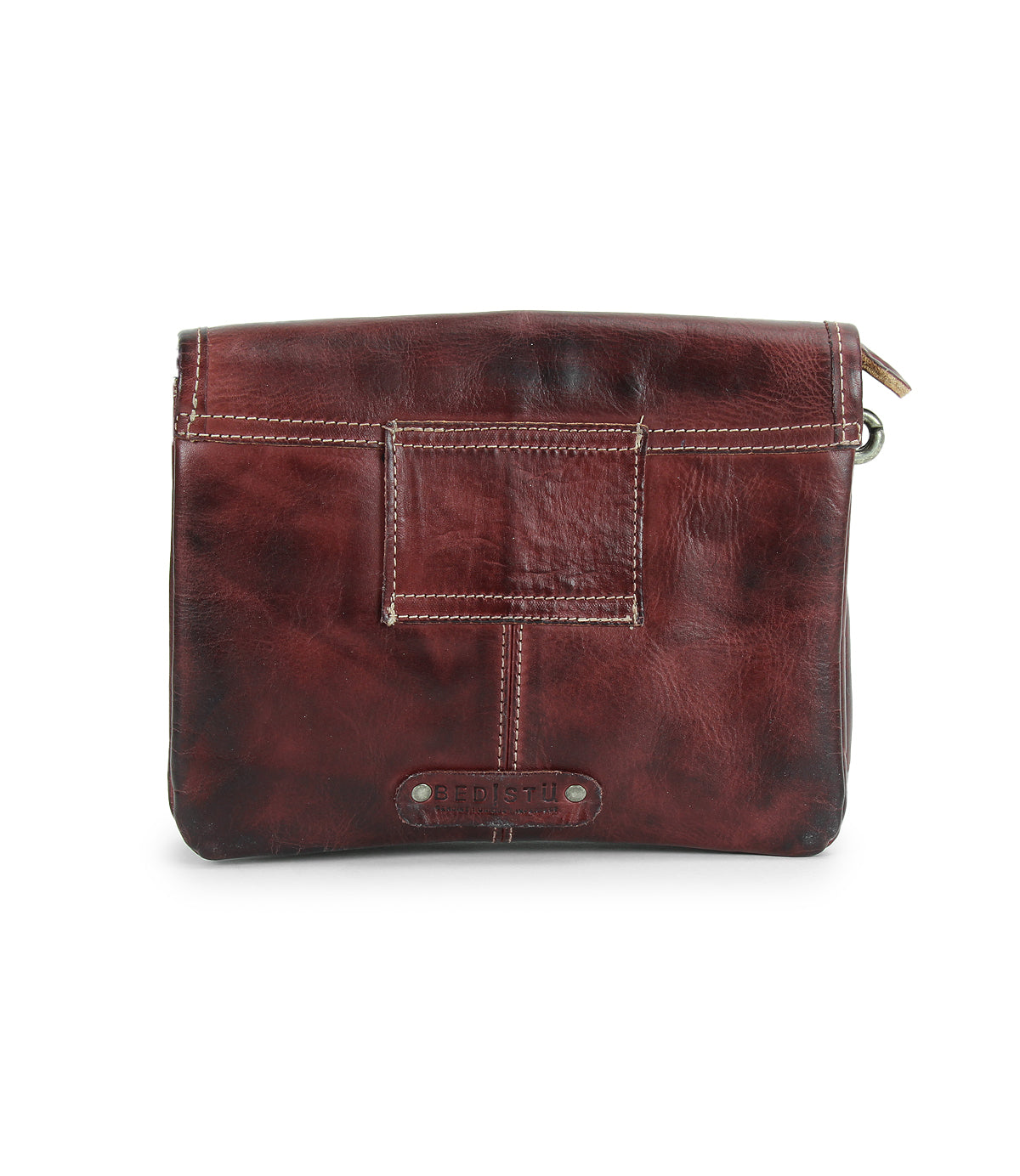 The Bed|Stü Ziggy JB is a brown leather crossbody bag featuring visible stitching, a front patch pocket, and a secure top zipper closure—perfect for anyone who values the practicality of a crossbody paired with timeless style.